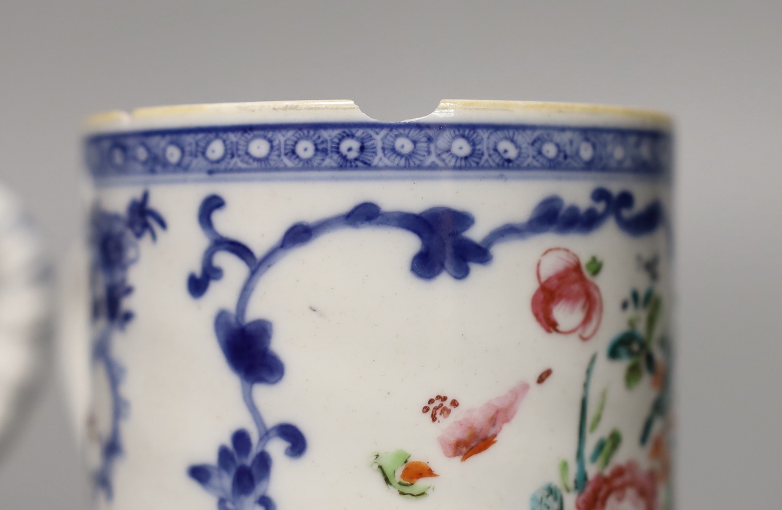 Two late 18th century Chinese exports famille rose mugs, tallest 12cm (2)